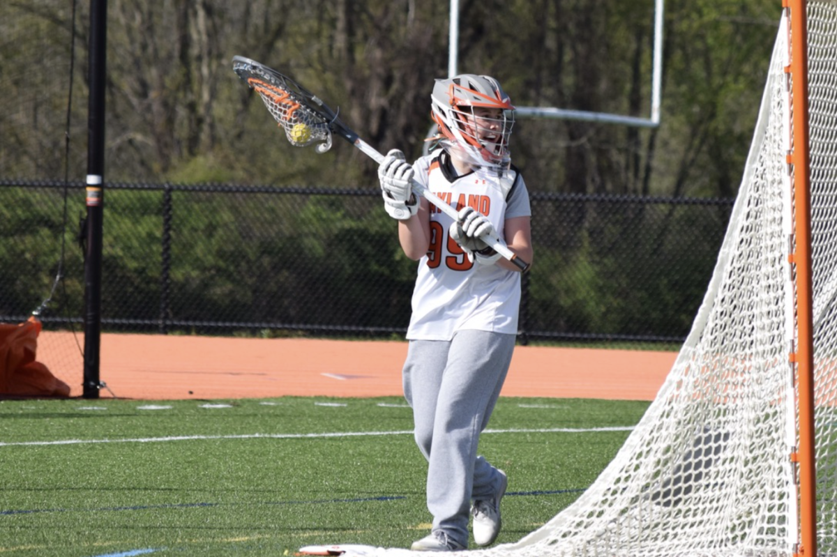 Sophomore Frankie Zilembo moves around the goal looking for a pass to a teammate to clear the ball. Zilembo was also on varsity her freshman year. 